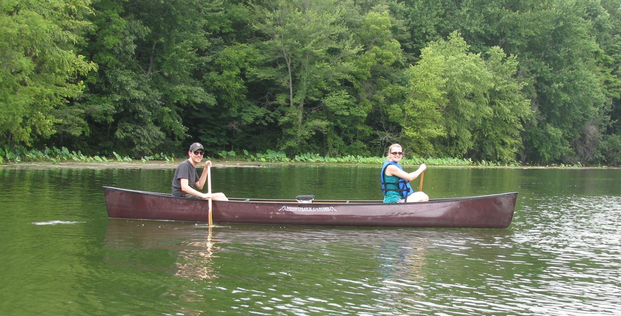 Paddling a Nighthawk canoe on the water